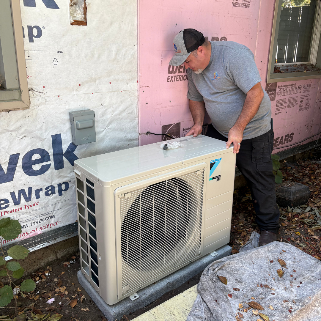 Expert technician installing Daikin outdoor air conditioning unit with proper positioning and connections in Salem Oregon
