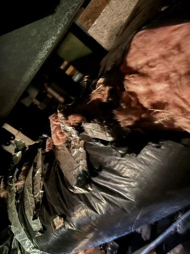 DiMartino's HVAC technician inspecting ductwork and HVAC system components in Salem Oregon crawl space during AC repair diagnosis