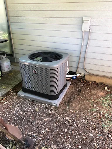 Professionally installed central air conditioning outdoor unit in Salem Oregon residential setting